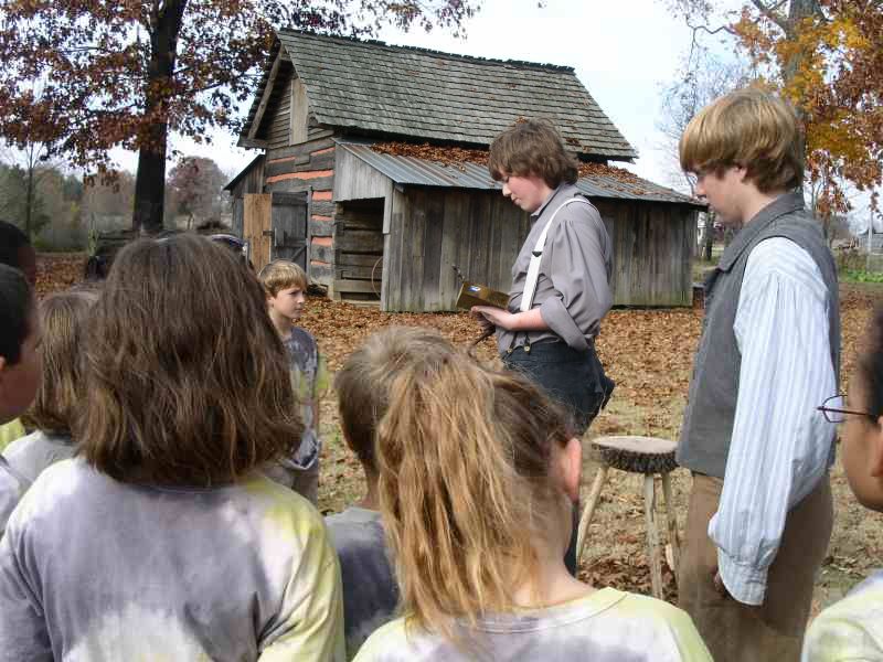 Samuel Reed demonstrates a brace and bit at Pioneer village
