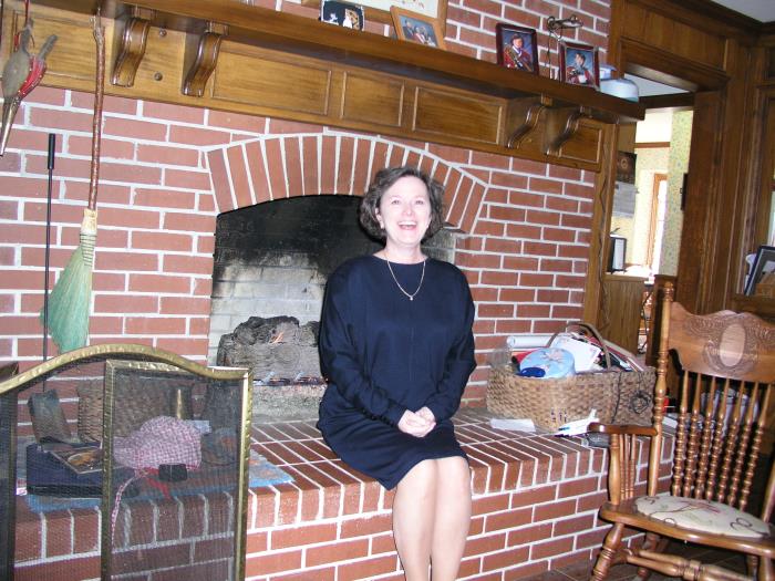 Natalee warms up at the fireplace