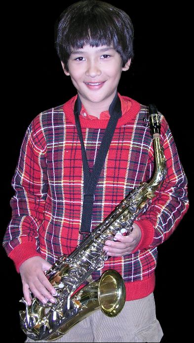 Edward with his SAX preparing for the Christmas concert